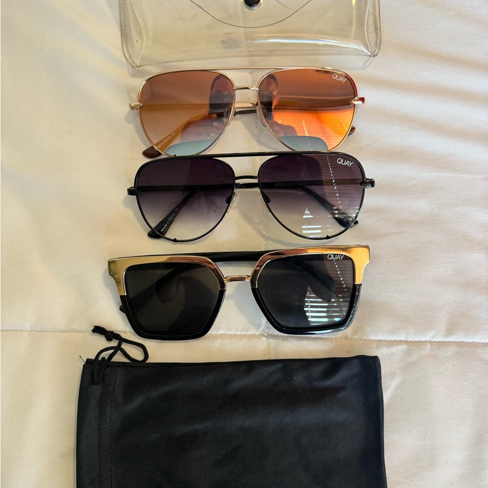 Quay sunglasses- 2- oversized gold & black aviators; 1- black/gold framed.
